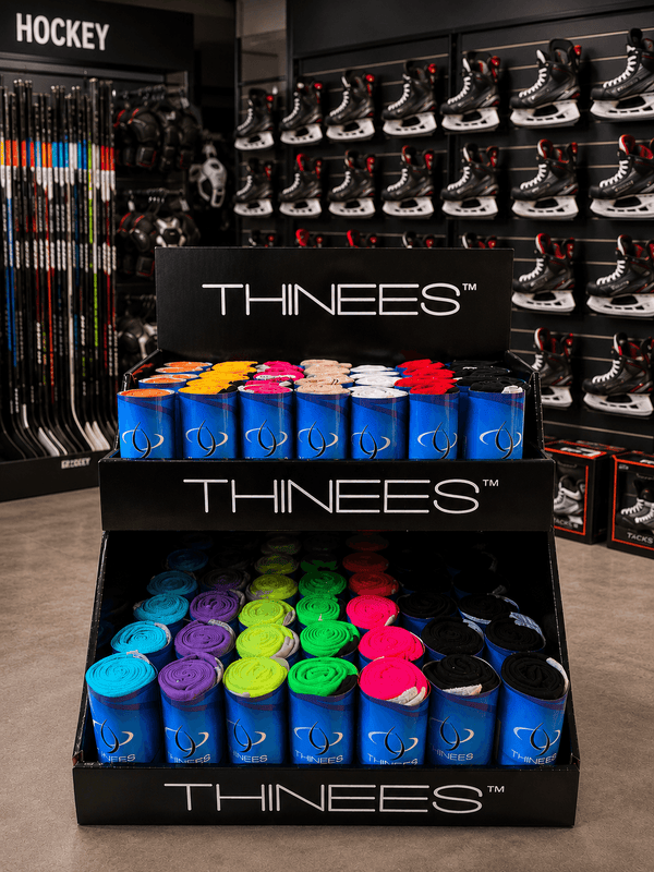 Thinees skate socks displayed in a retail store display case